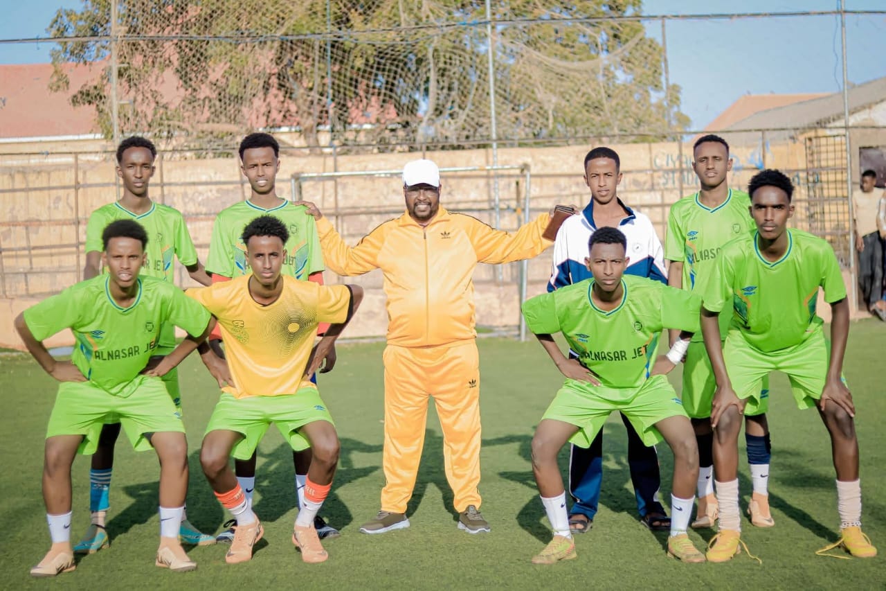 A football team gathered outdoors